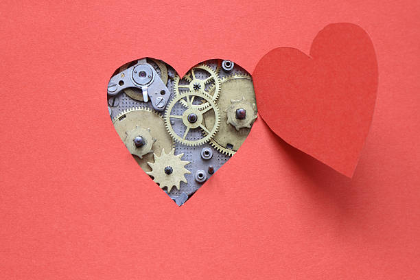 Robot Love. Cogs inside a red heart cut out.
